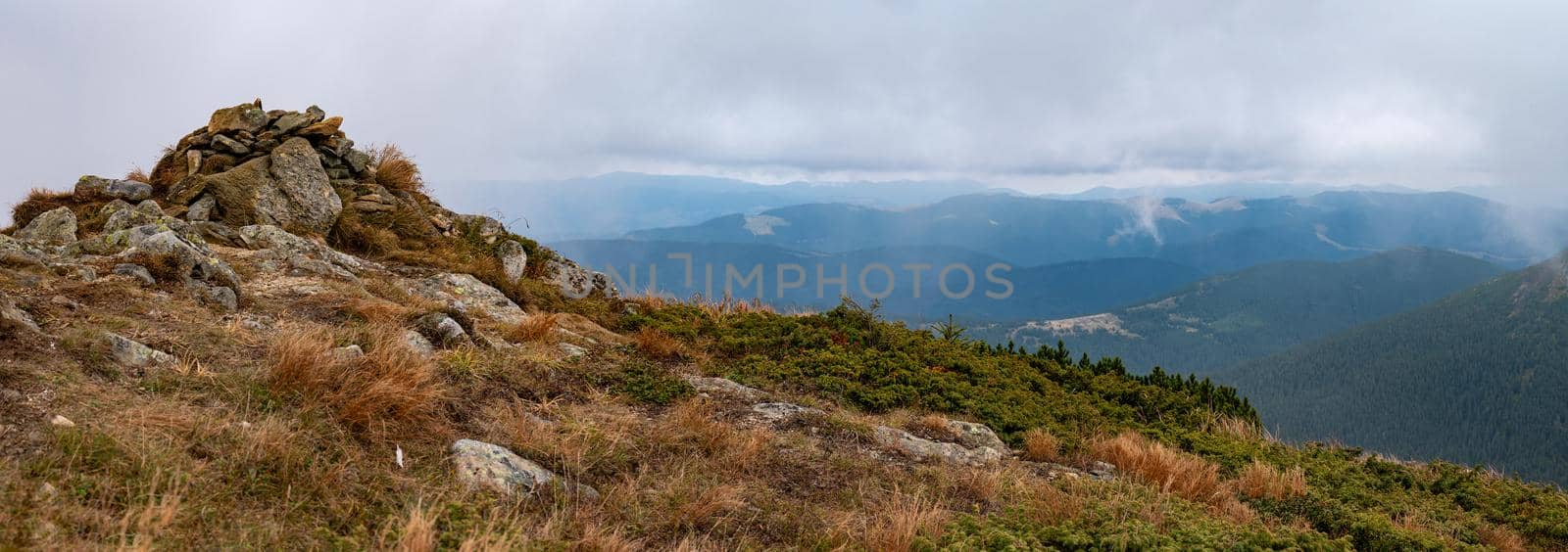 mountain top made of stones, rocky mountains with autumn landscape. by Niko_Cingaryuk