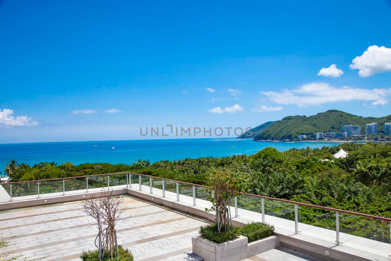 Sea View Hotel with Green Foliage and Blue Sky