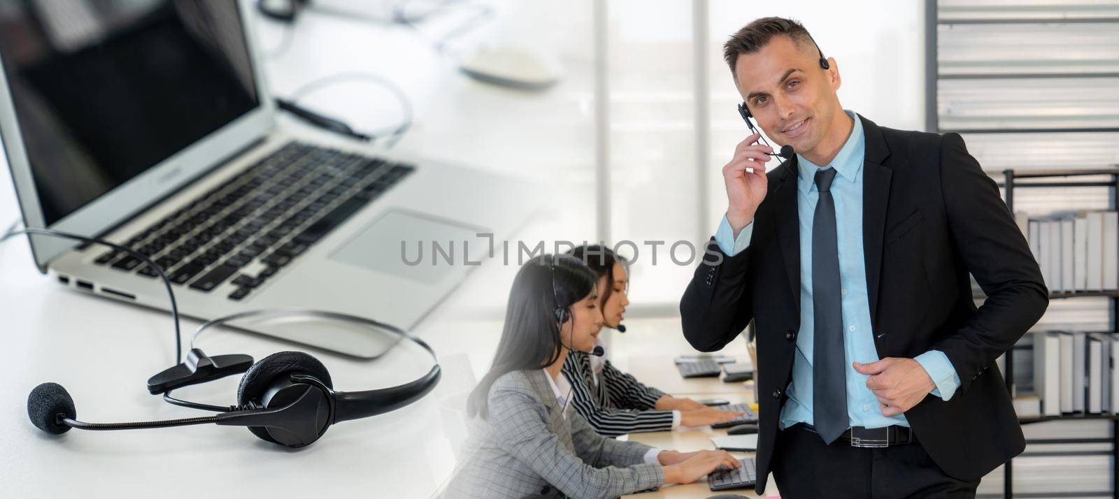 Business people wearing headset working in office to support remote customer or colleague. Call center, telemarketing, customer support agent provide service in broaden view .