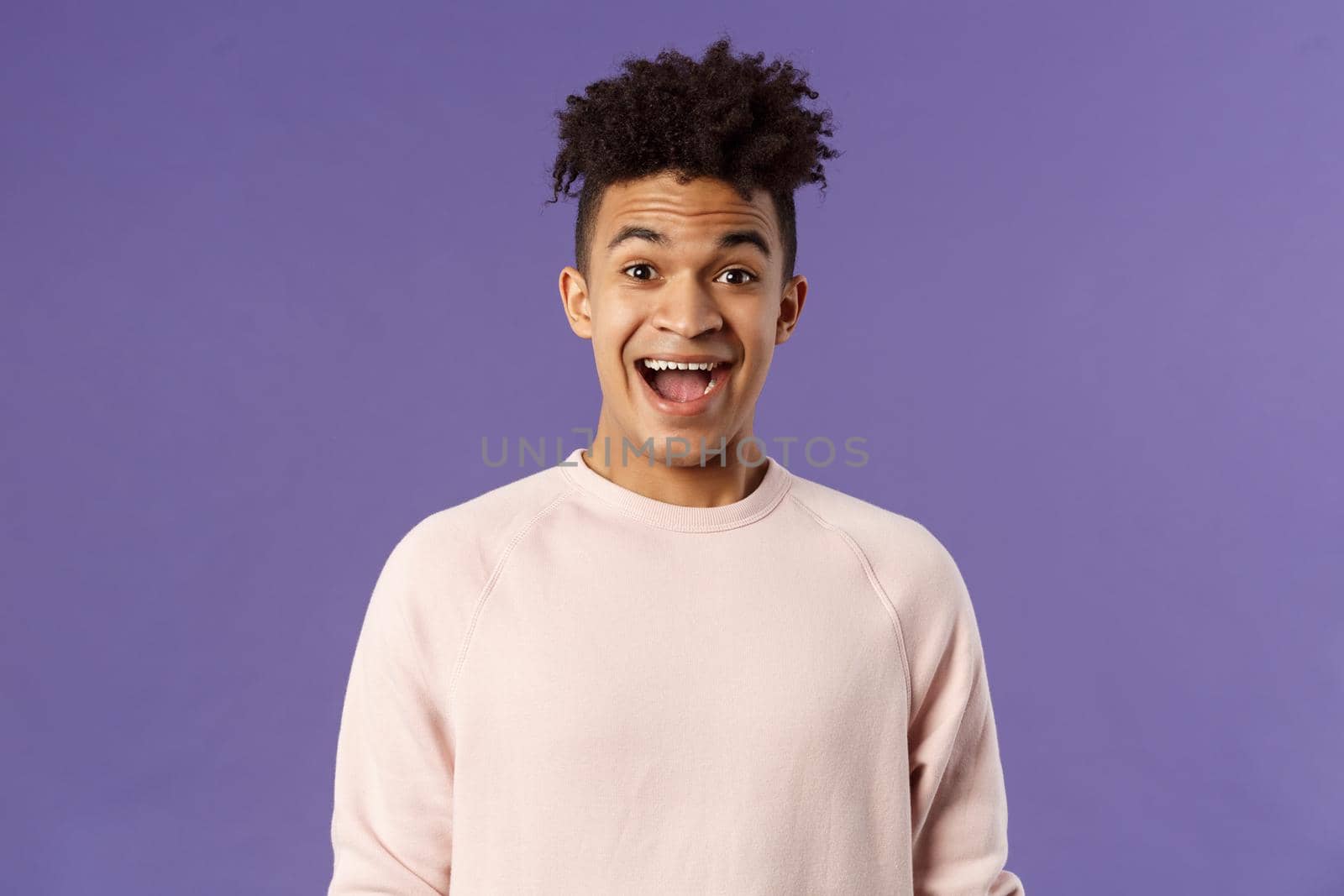 Close-up portrait of enthusiastic, excited and surprised hispanic guy hear amazing news, open mouth beaming smile from amazement and joy, rejoicing glad for friend achievement, purple background by Benzoix