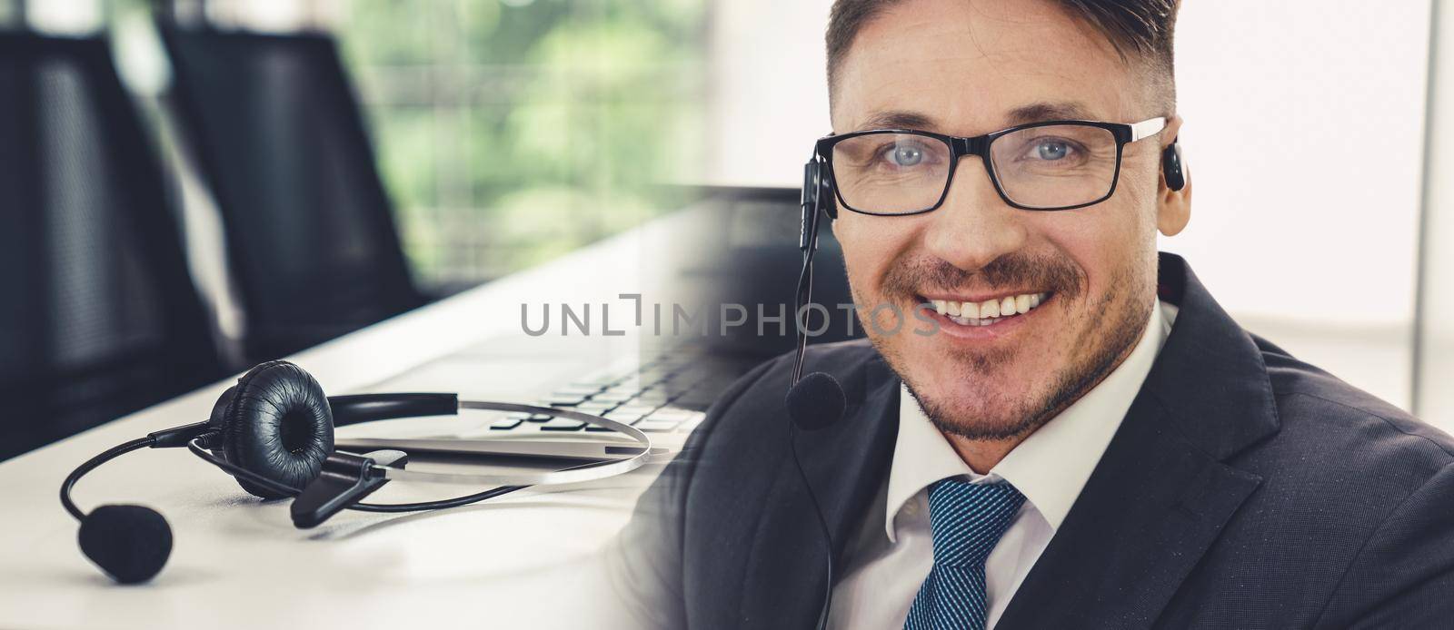 Business people wearing headset working in office broaden view by biancoblue