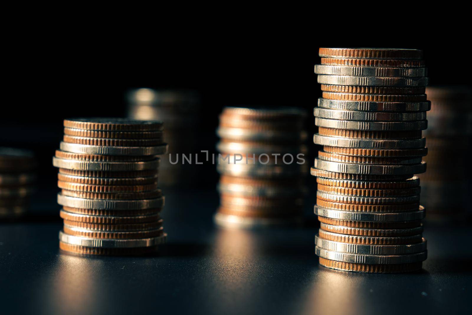 Pile of gold coins stack in finance treasury deposit bank account for saving . Concept of corporate business economy and financial growth by investment in valuable asset to gain cash revenue profit .