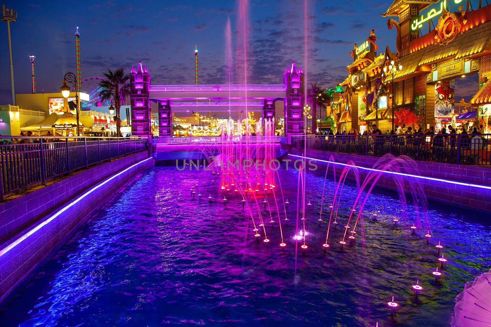 Dubai Global Village Night Lights and water view by kisika