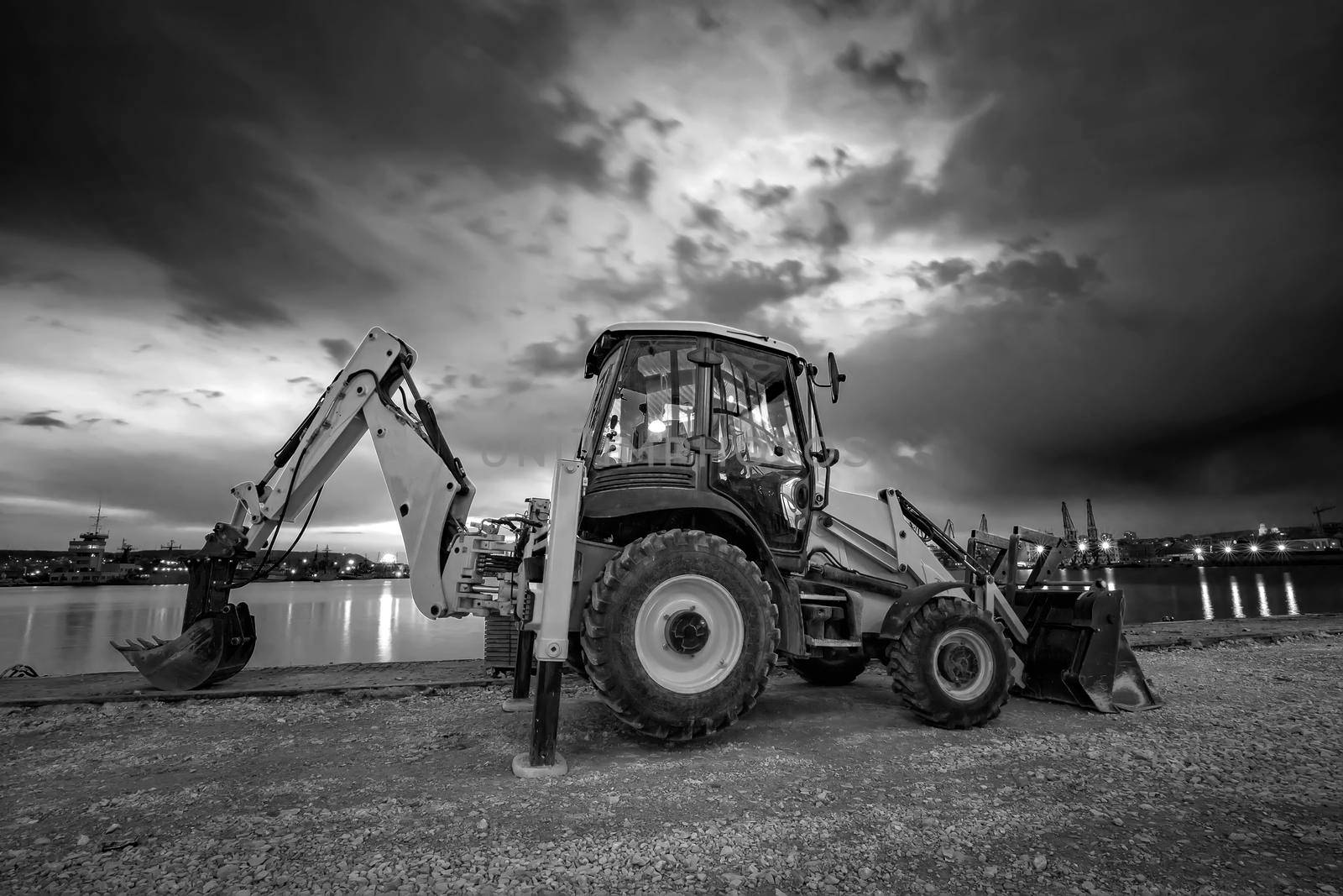 Amazing black and white view of the stopped excavator at the construction site
