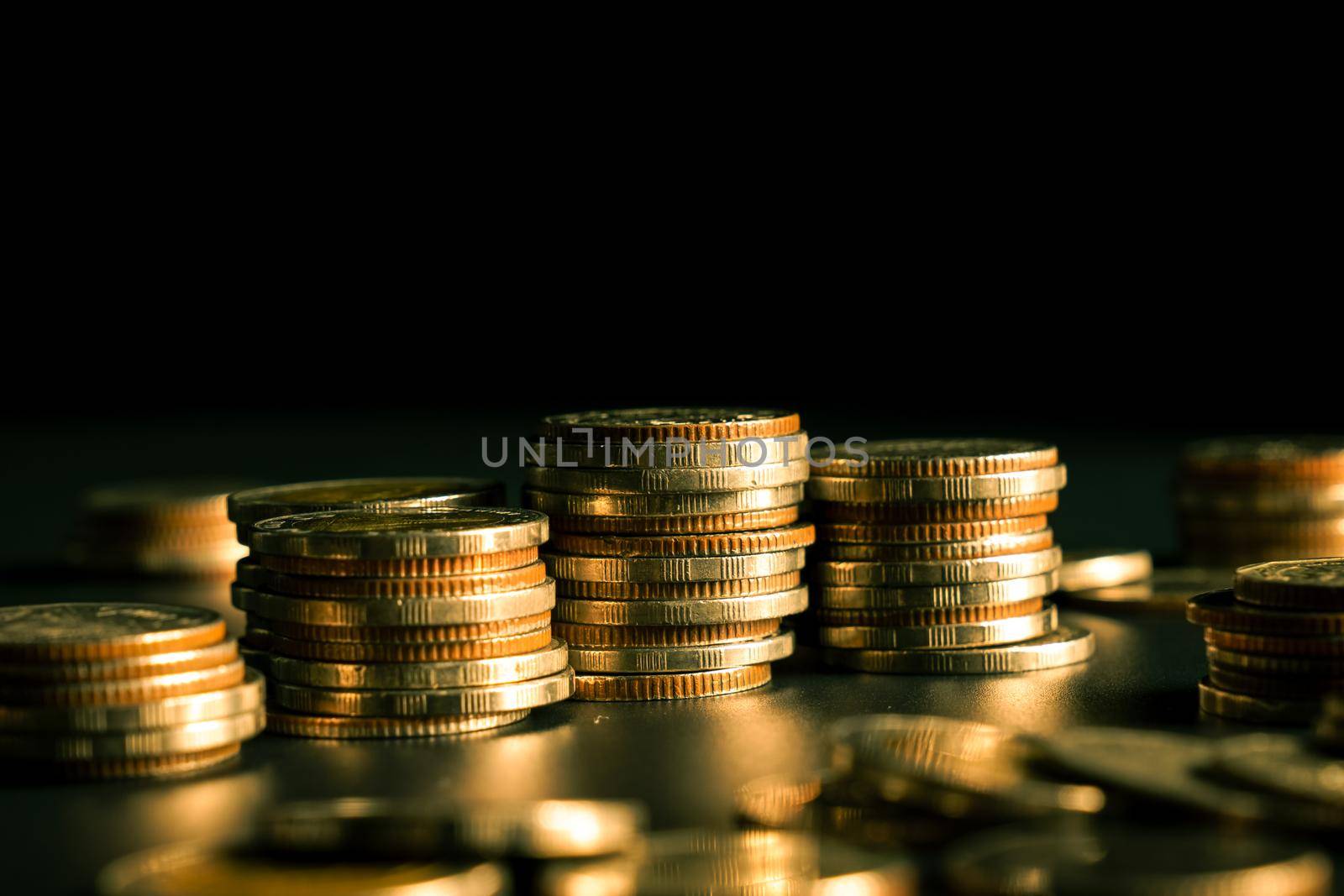 Pile of gold coins stack in finance treasury deposit bank account for saving . Concept of corporate business economy and financial growth by investment in valuable asset to gain cash revenue profit .
