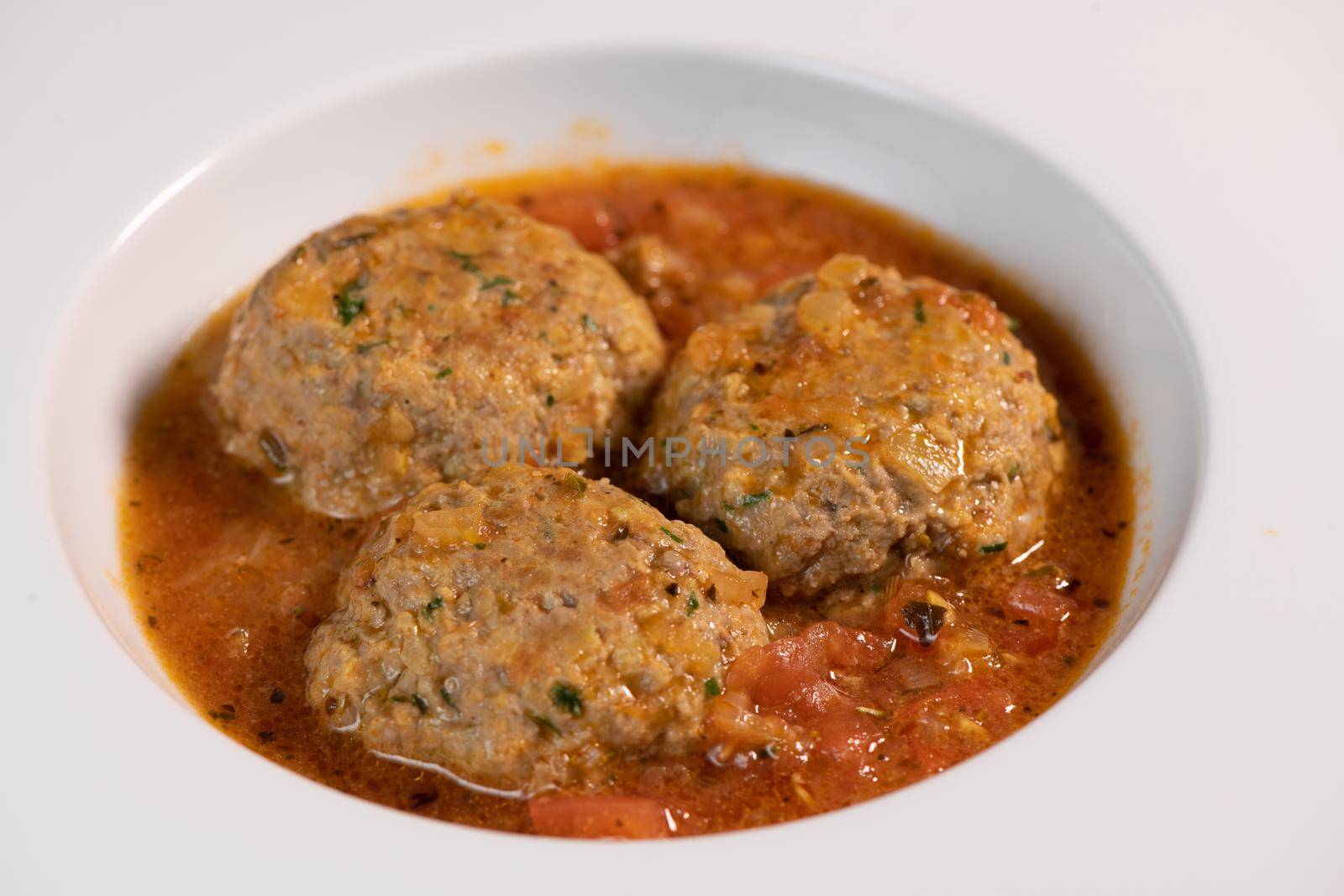 Recipe for meatballs in tomato sauce with hazelnut potatoes. High quality photo