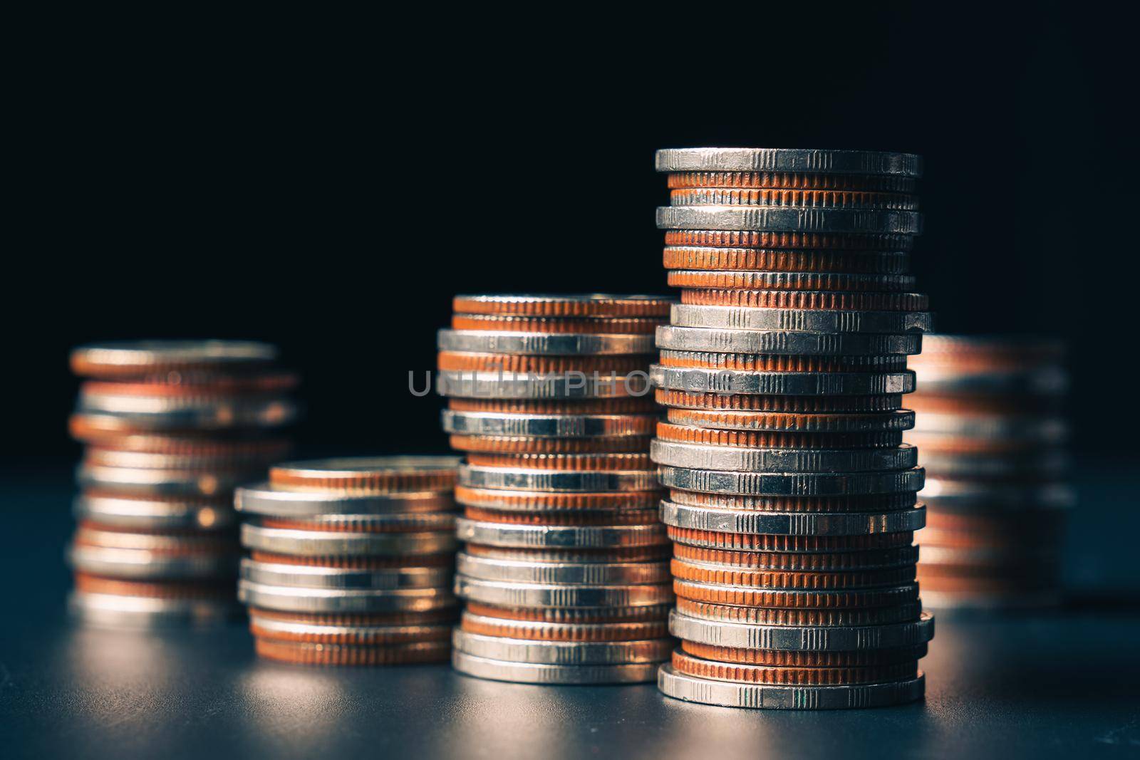 Pile of gold coins stack in finance treasury deposit bank account for saving . Concept of corporate business economy and financial growth by investment in valuable asset to gain cash revenue profit .