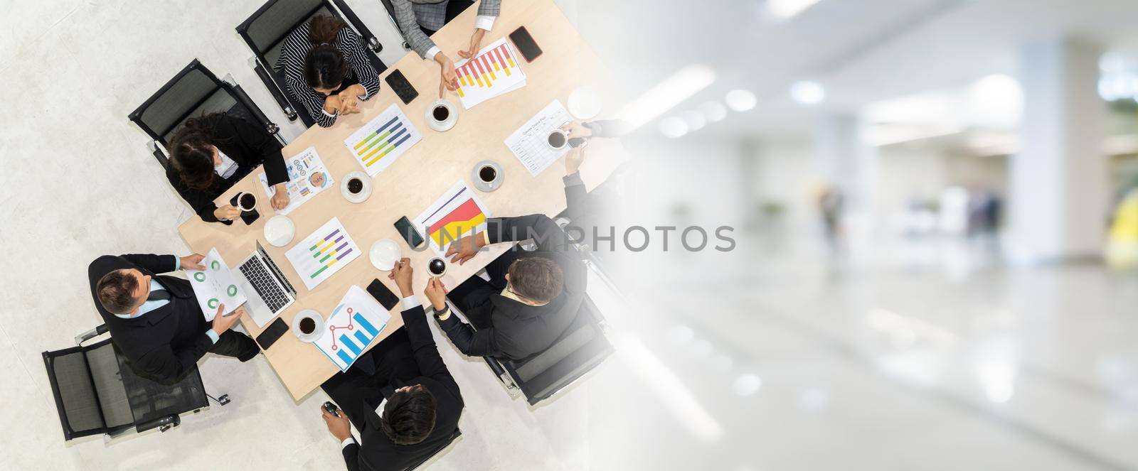 Business people group meeting shot from top view in office . Profession businesswomen, businessmen and office workers working in team conference with project planning document broaden view .