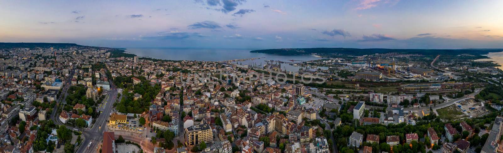 Varna, Bulgaria - May 30, 2019: Amazing detail aerial panorama of Varna city, bay and lake at sunset