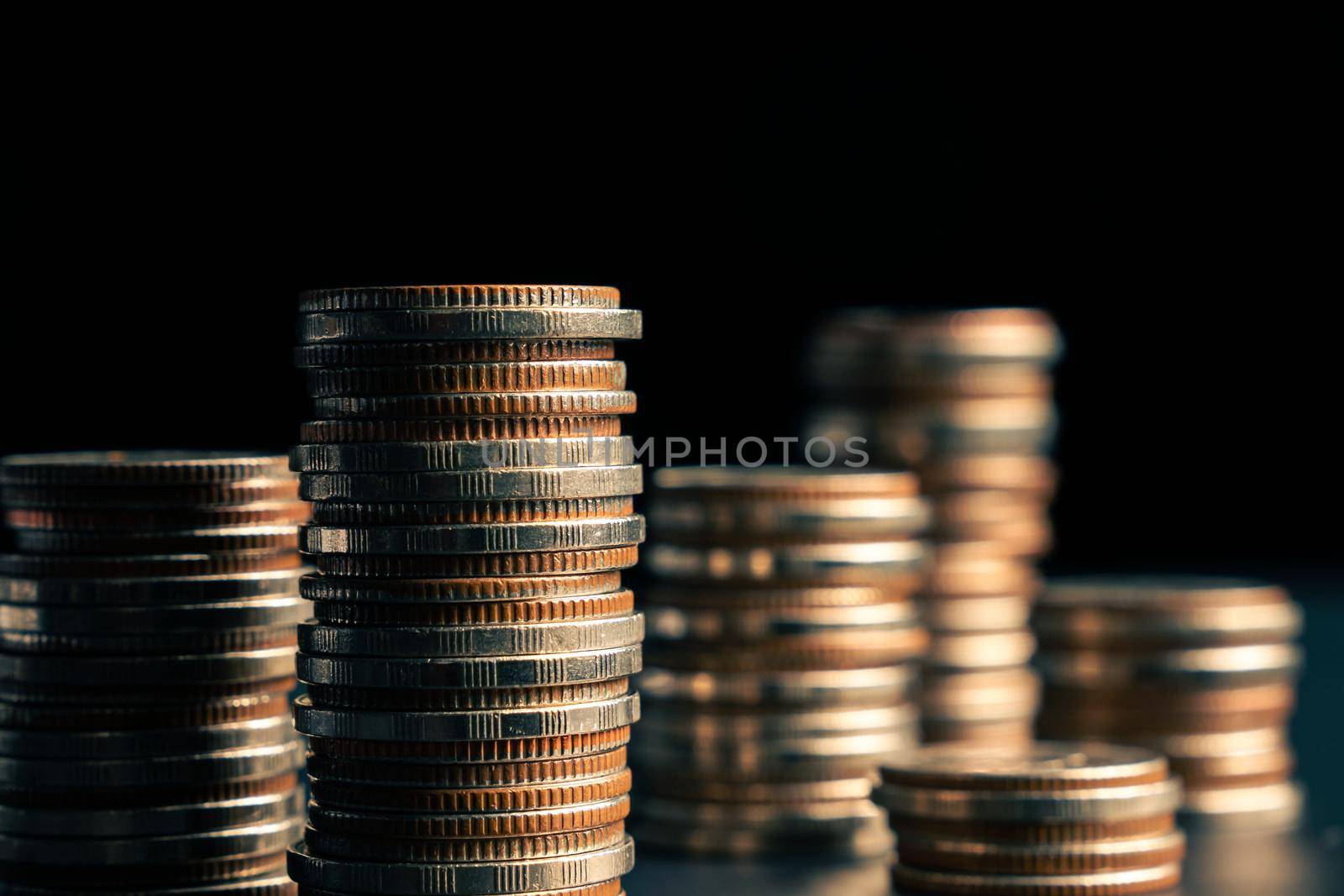 Pile of gold coins stack in finance treasury deposit bank account for saving . Concept of corporate business economy and financial growth by investment in valuable asset to gain cash revenue profit .