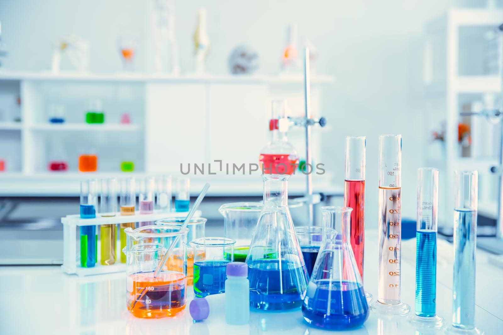Glass flask in Science Chemical laboratory or Medical research lab with colorful liquid for background