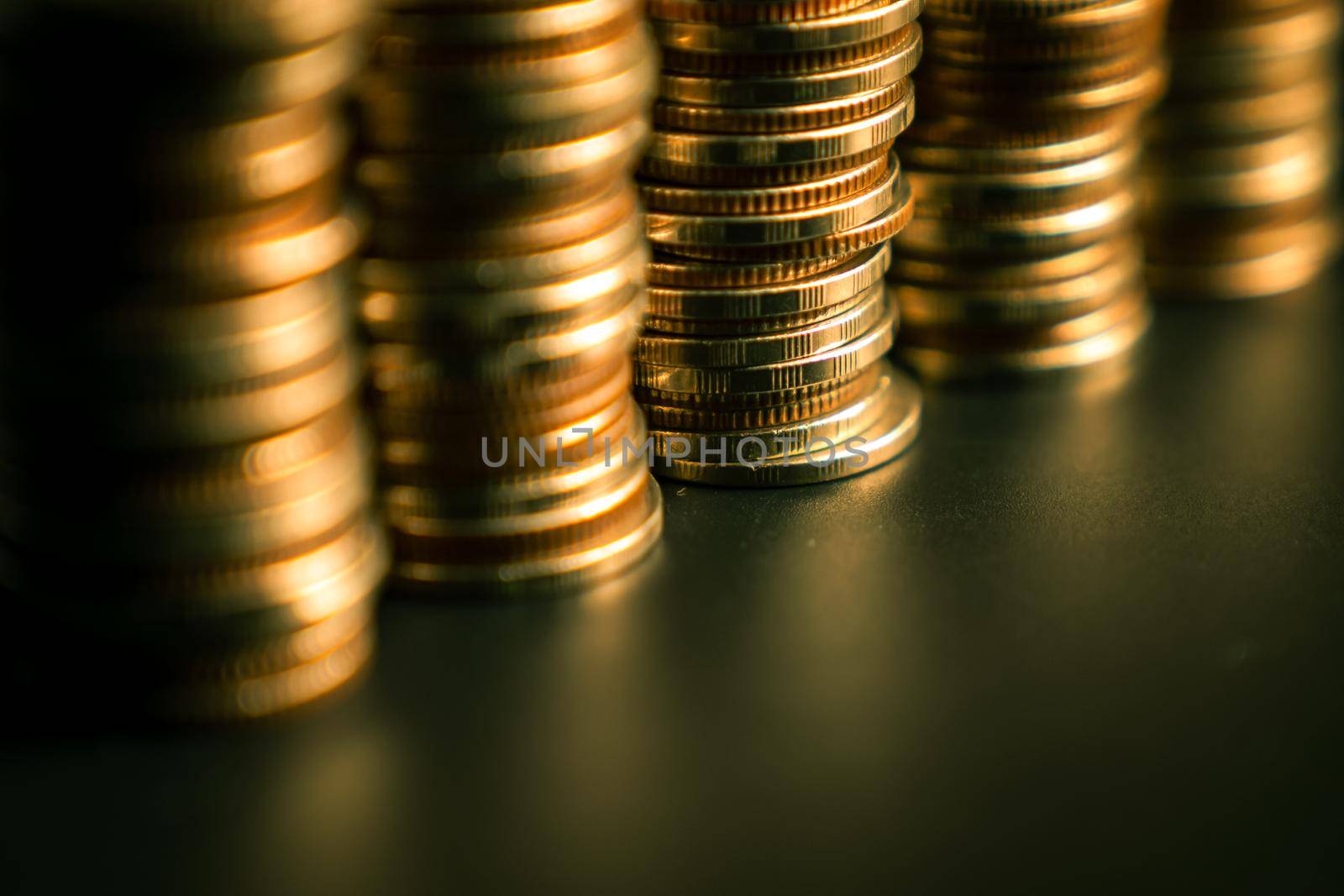 Pile of gold coins stack in finance treasury deposit bank account for saving . Concept of corporate business economy and financial growth by investment in valuable asset to gain cash revenue profit .