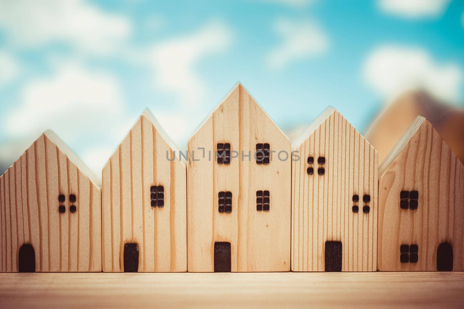 wooden home model toy many house row community art decoration for background vintage colortone.