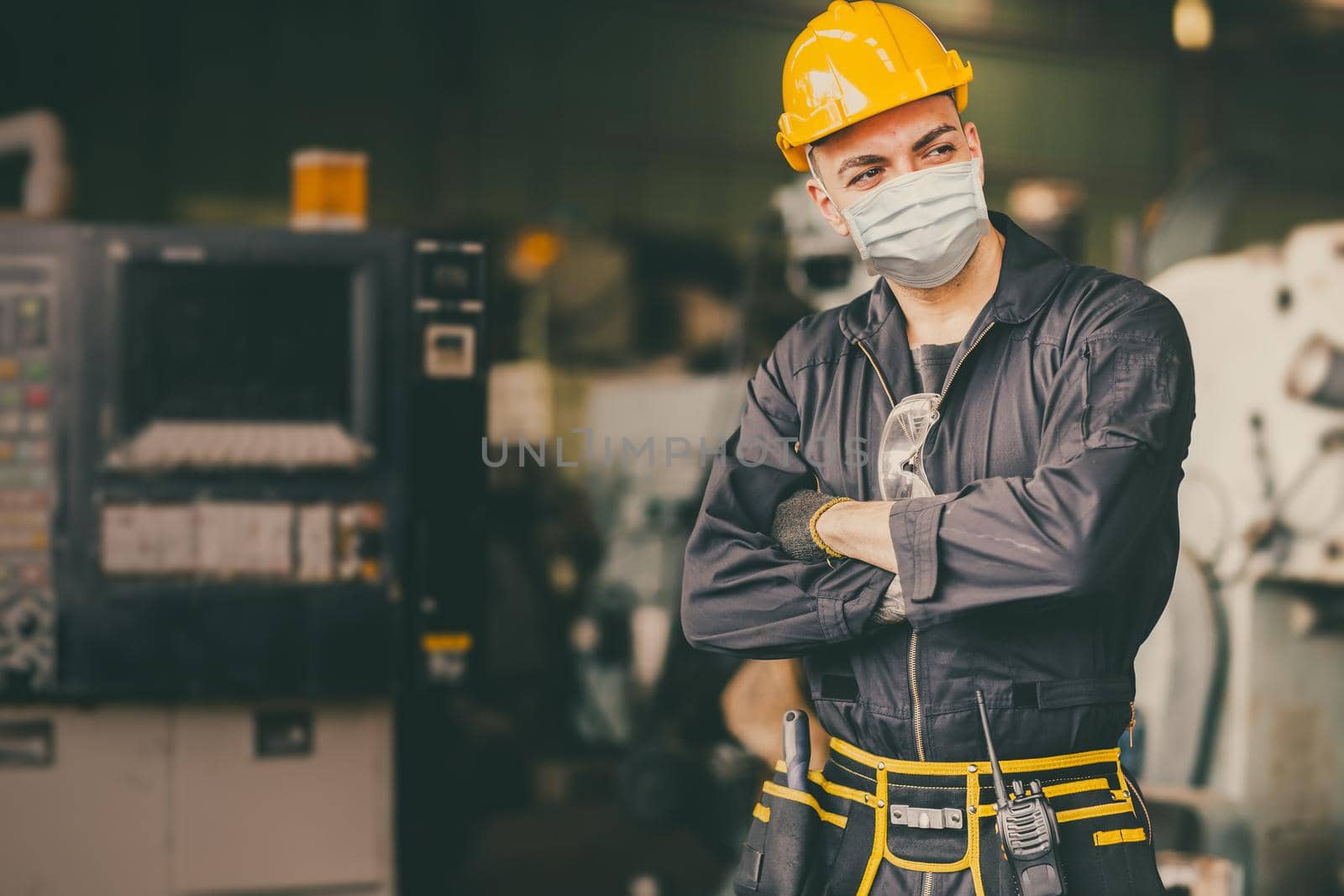 Industry engineer man male worker wear face mask during service working in factory to prevent Covid virus air dust pollution and for good healthy. by qualitystocks