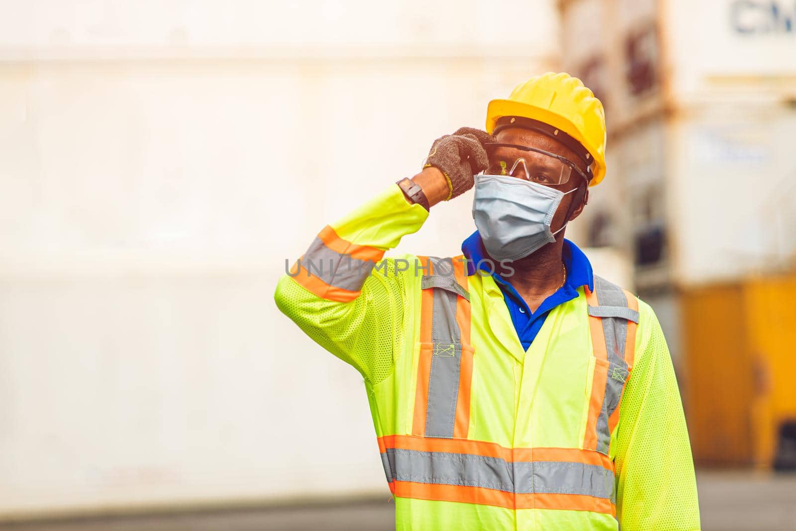 Worker wear disposable face mask for protection Corona Virus Spreading and Smoke dust air pollution filter in cargo port shipping industry.