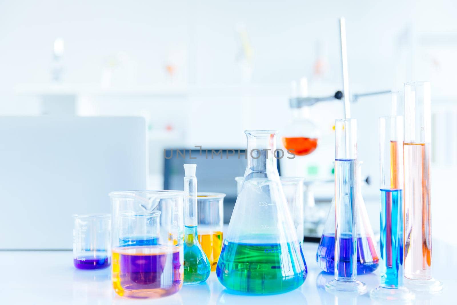 Glass flask in Science Chemical laboratory or Medical research lab with colorful liquid for background