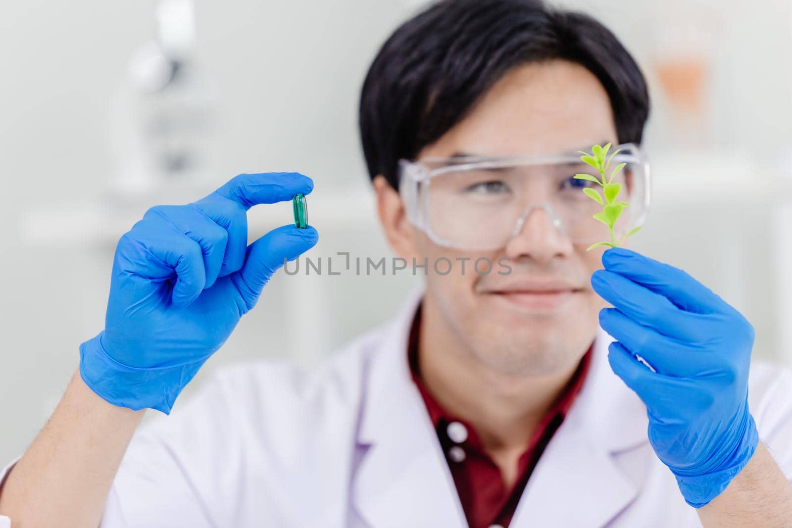 Scientist doctor extract medicine from natural plant leaf in medical lab. green medication from nature concept. by qualitystocks