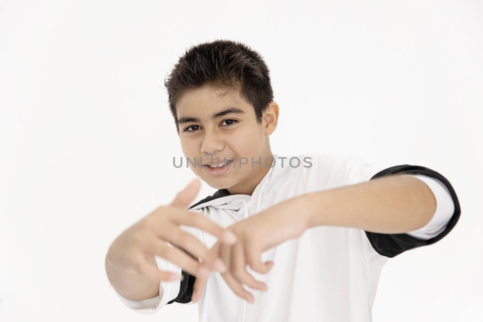 Closeup Asian teen boy teenager dancing hiphop. Kids enjoy dance hand rising greeting happy smile funny isolated on white background.