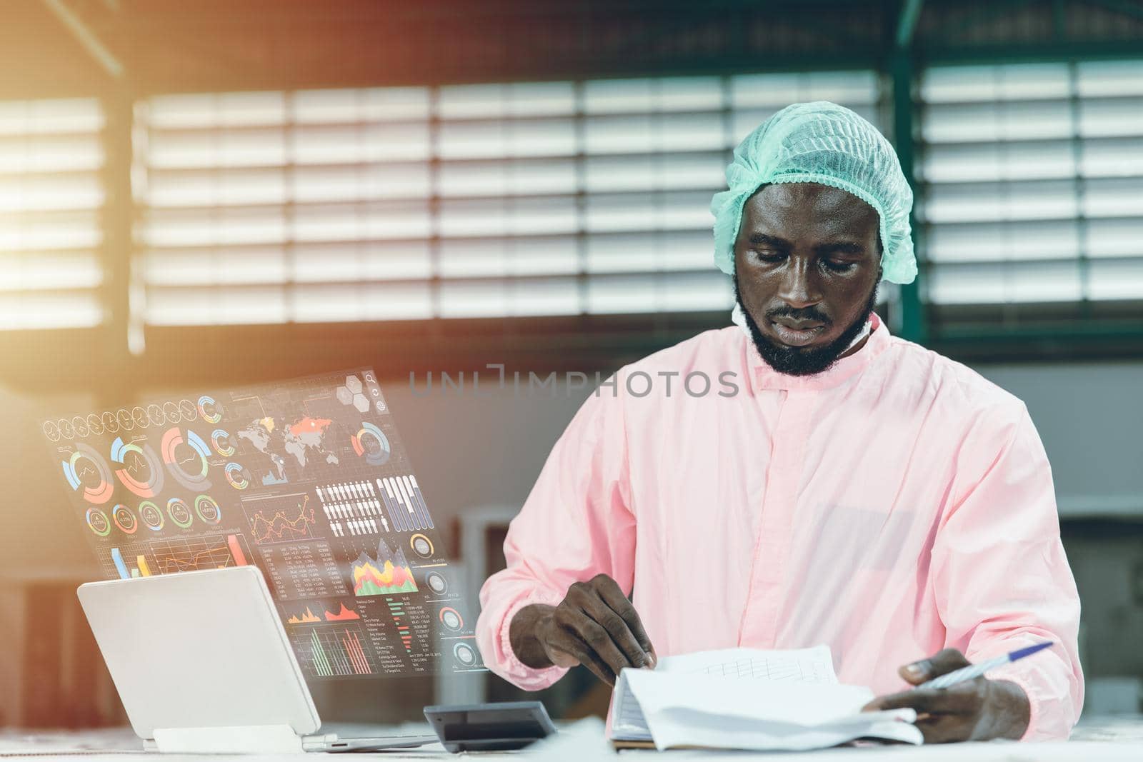 Factory worker working with advanced technology computer device with hologram mornitor display show AI business report data information support working and decision.