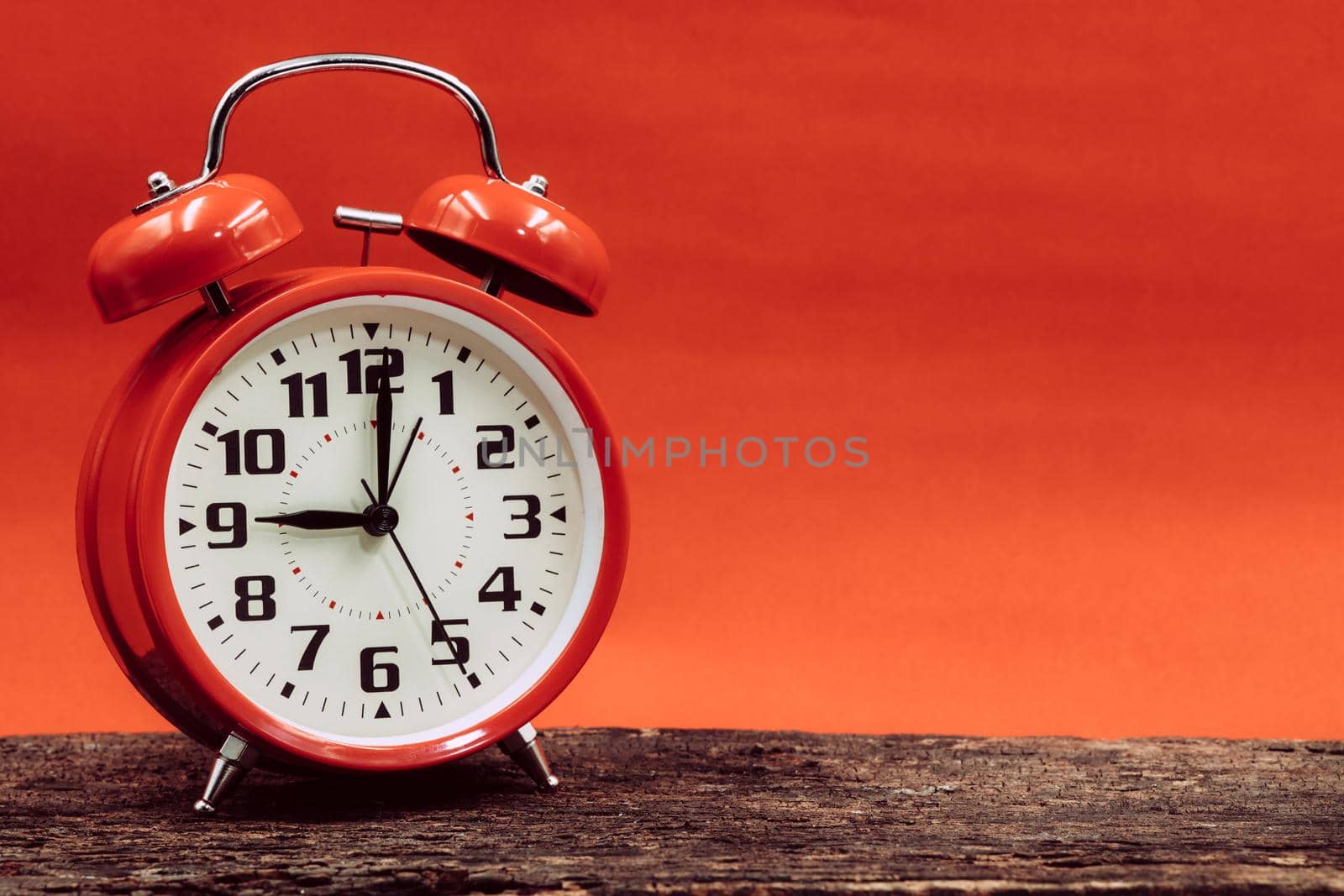 9 o'clock retro clock on wooden with red sun dusk dawn day sky background.