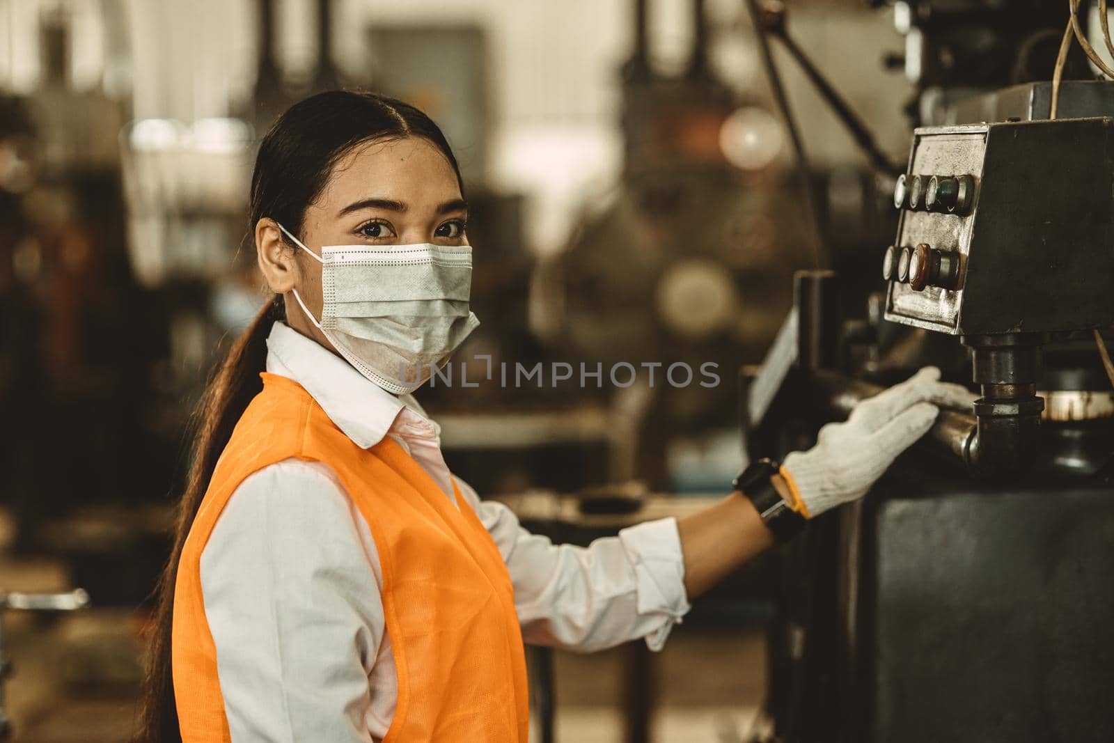 Women worker wear disposable face mask for protection Corona Virus Spreading and smoke dusty air pollution filter in factory for healthy labor care. by qualitystocks