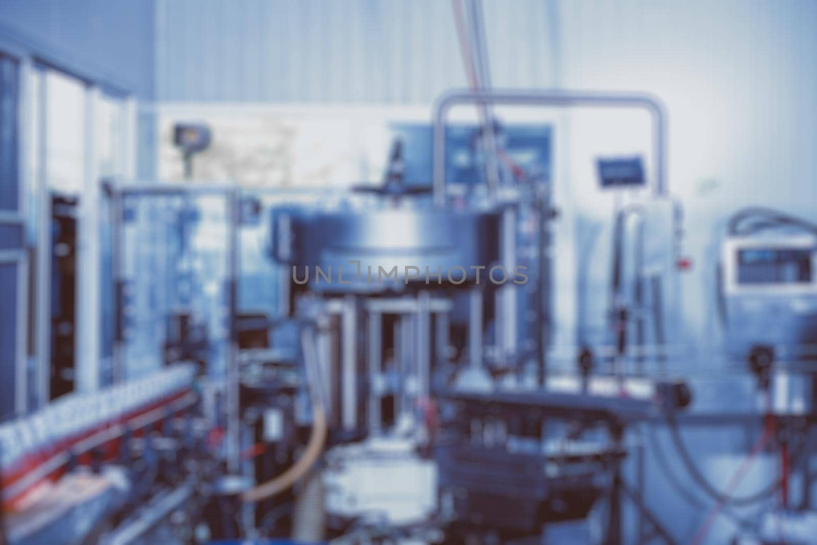 blur drink automate no worker machine in food factory production line blue color tone abstract for background by qualitystocks