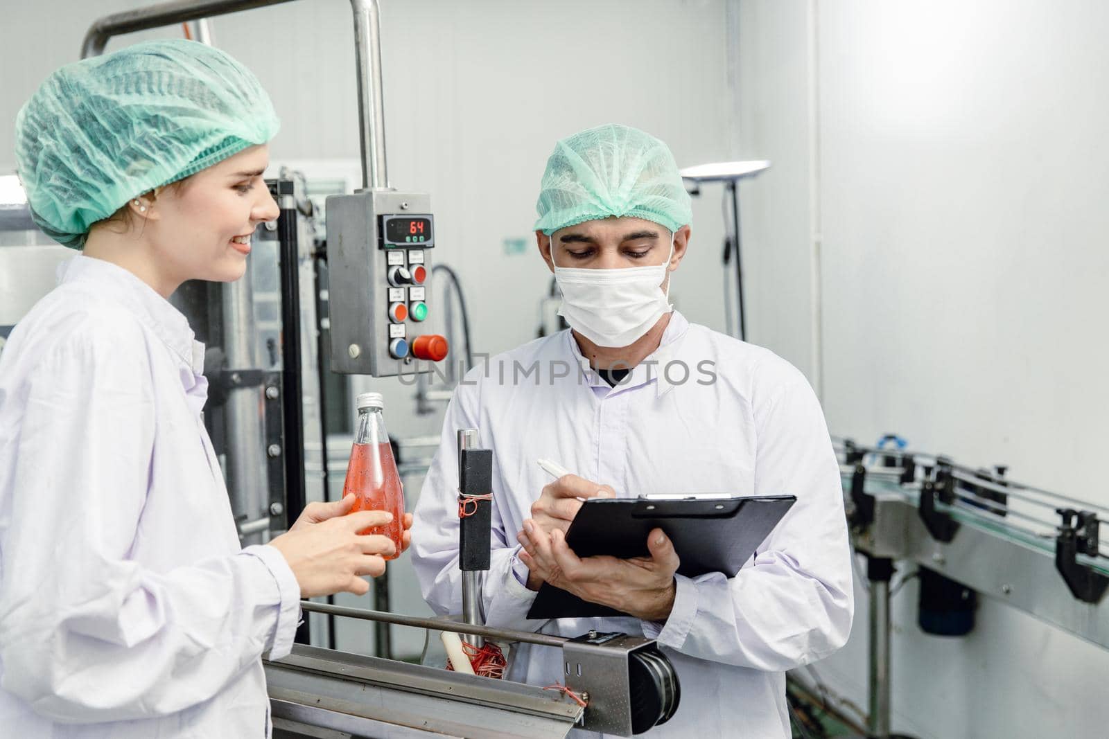 Food and drink factory ISO audit quality control team working, hygiene check and process standard inspection in plant production line. by qualitystocks