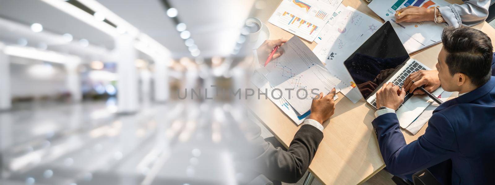 Business people group meeting shot from top widen view in office . Profession businesswomen, businessmen and office workers working in team conference with project planning document on meeting table .