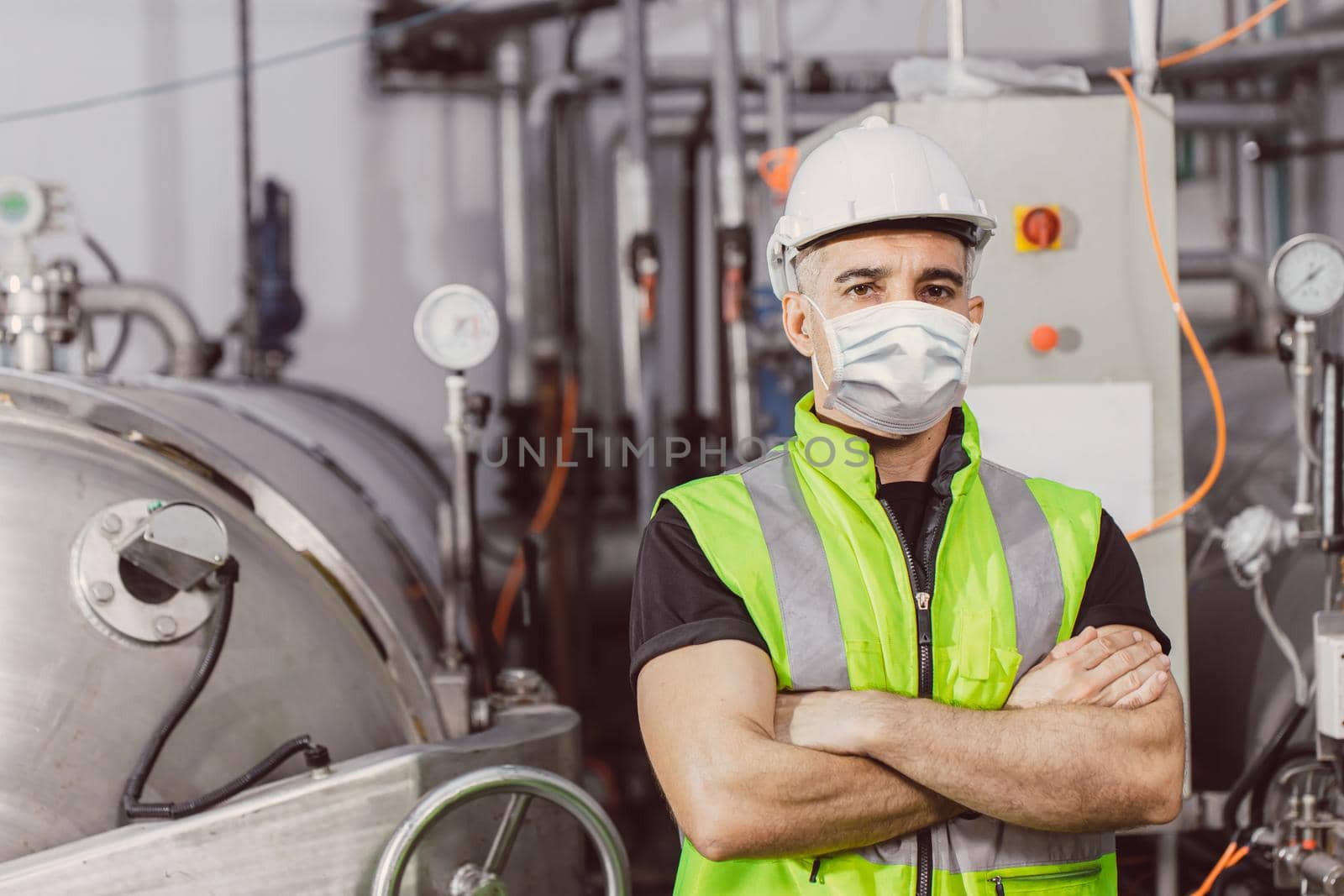Engineer worker wear disposable face mask for protection Corona Virus Spreading and Smoke dust air pollution filter in factory for healthy labor care. by qualitystocks