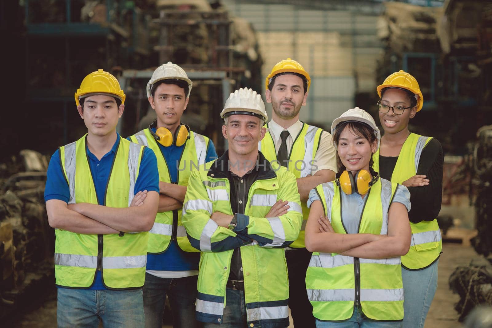 Group of industry people worker engineer team mix race enjoy working in heavy factory standing together happy smile portrait confidence teamwork company arm crossed