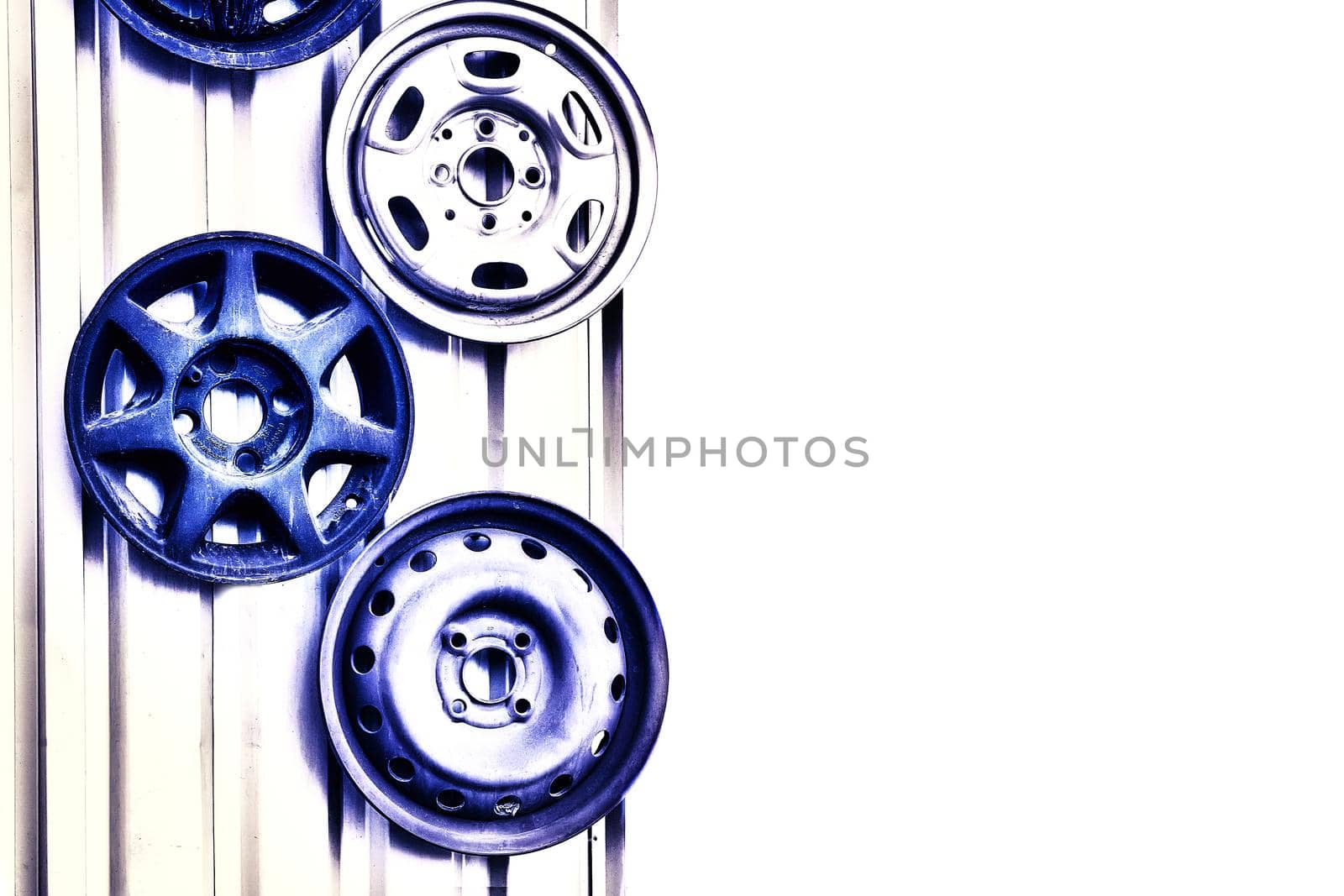 Three metal car rims hanging on the wall with space for text by jovani68