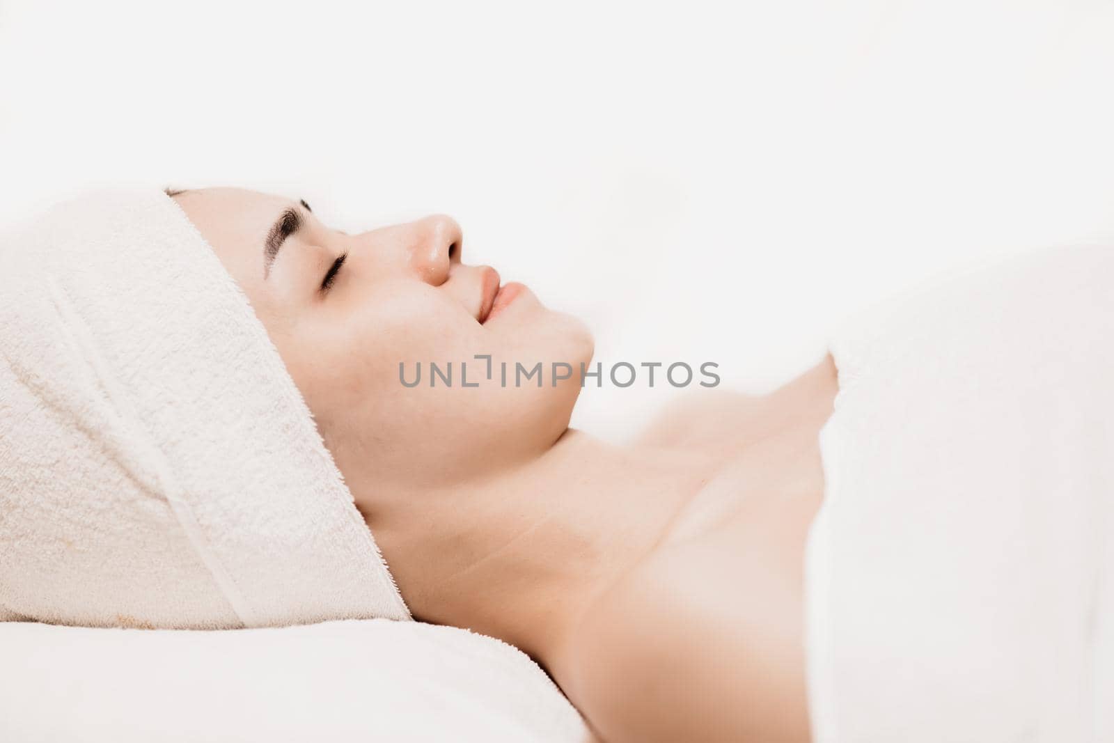 Asian women sleeping relax for beauty facial health skin care and hair treatment in spa salon. by qualitystocks