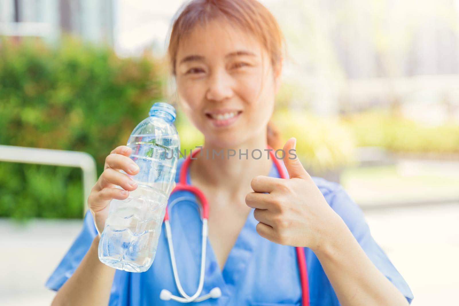 Doctor female with drinking water for good health in hot day for fresh and healthy lifestyle.