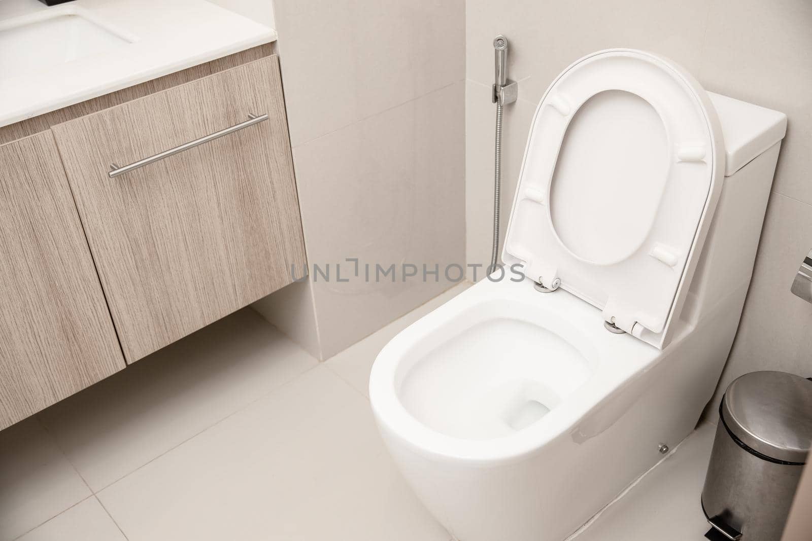 Clean Toilet bowl in hotel bathroom interior decoration by qualitystocks