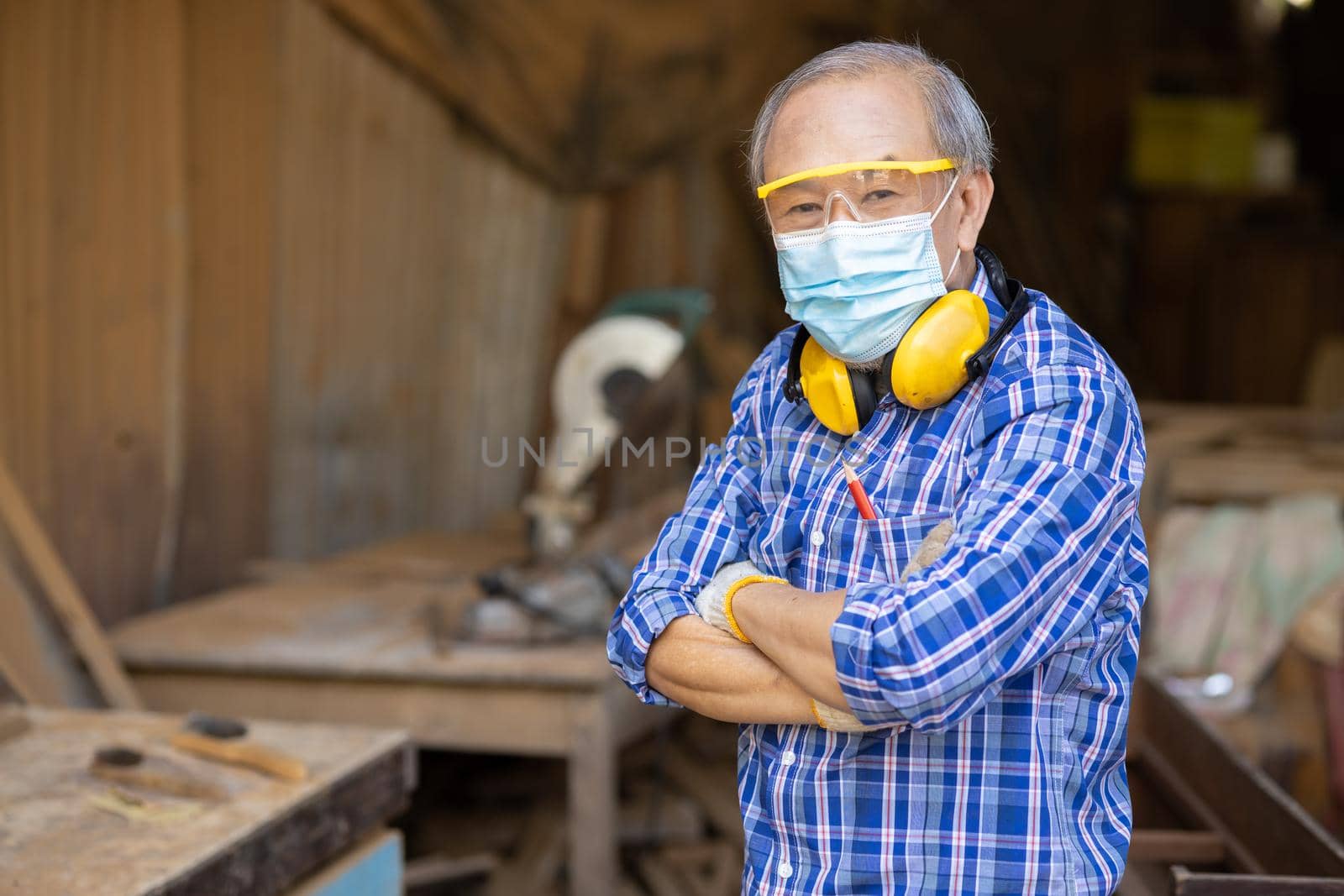 Portrait of elder wood worker hobby for good retirement, Asian male mature professional master of wood craft furniture wooden maker man.