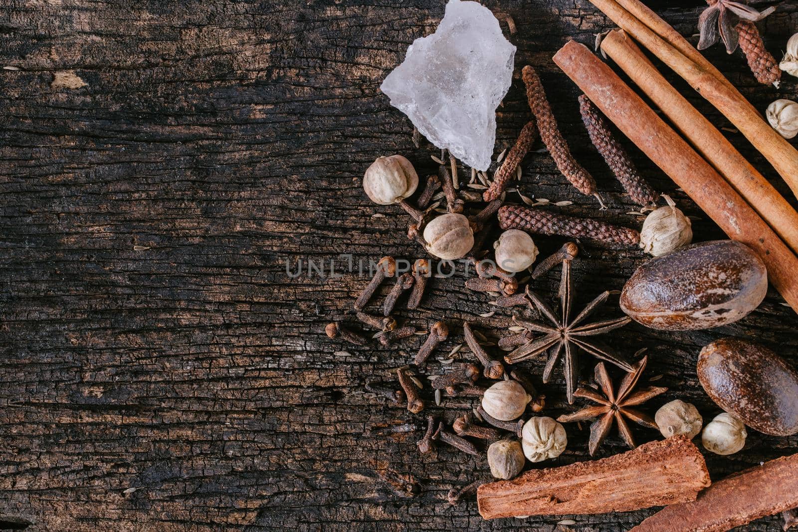 Chinese Indian Thai Dried mix herbal medicine or food ingredient or aroma extract on old wooden background with space for text. by qualitystocks