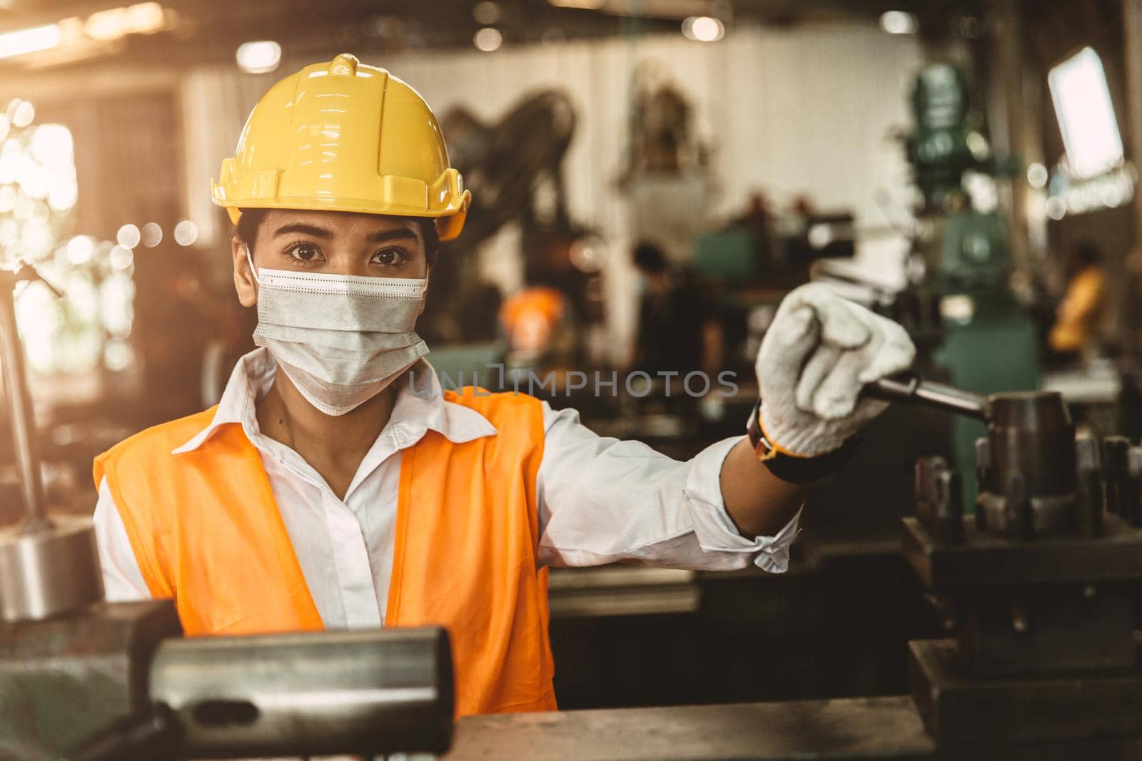 Asian women worker wear disposable face mask for protection Corona Virus Spreading and smoke dust air pollution filter in factory for healthy labor care.