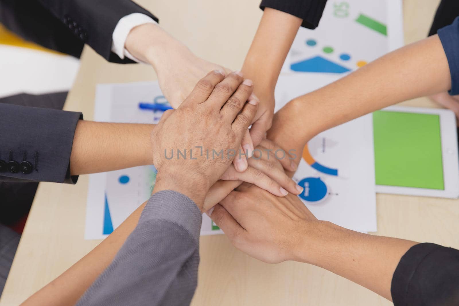 Closeup topview businesspeople join hand together.Stack of people hands. Unity and Team Teamwork Empower business worker for company concept. by qualitystocks