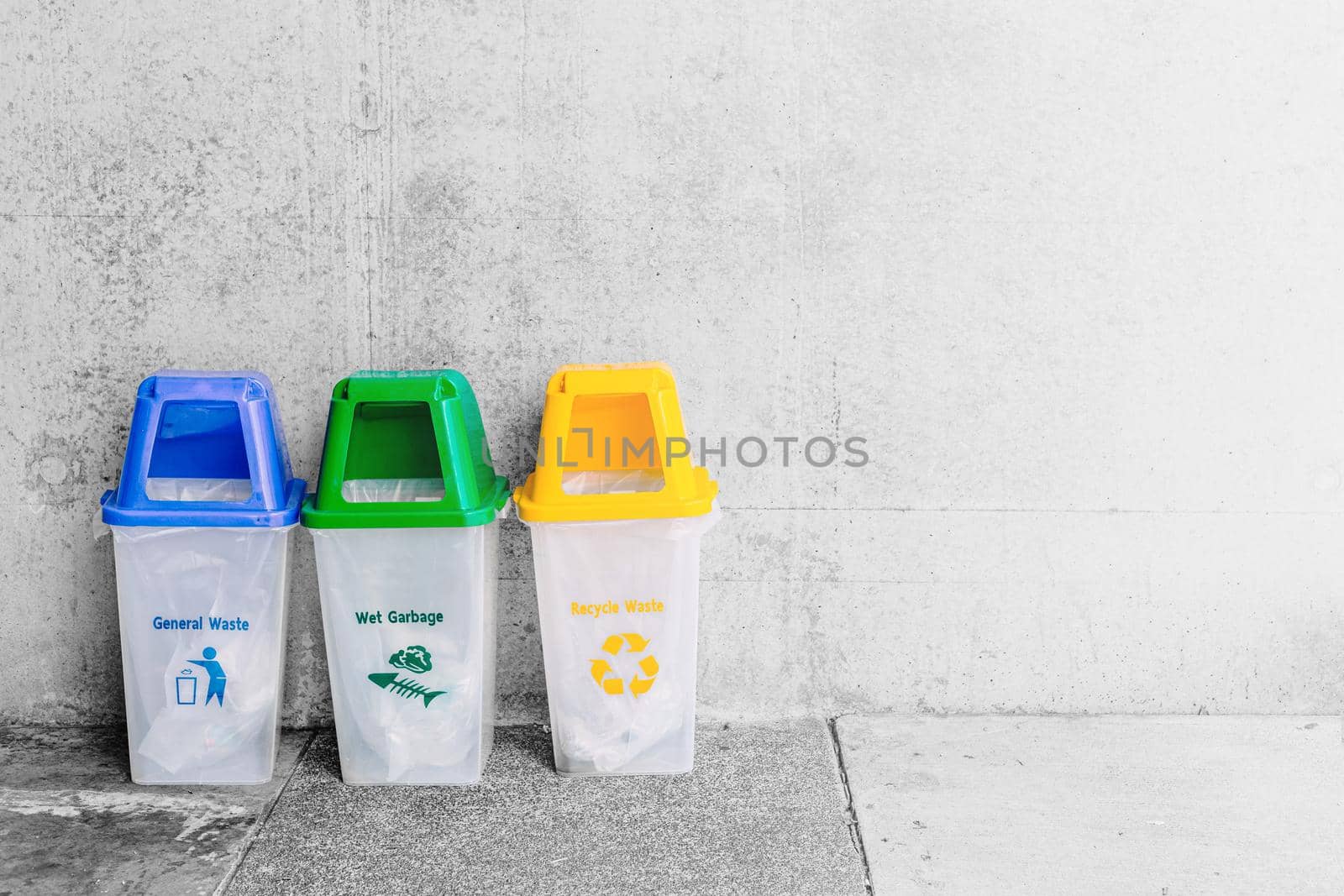 General Waste blue Wet Garbage green and Recycle Waste Yellow trash bin with space for text.