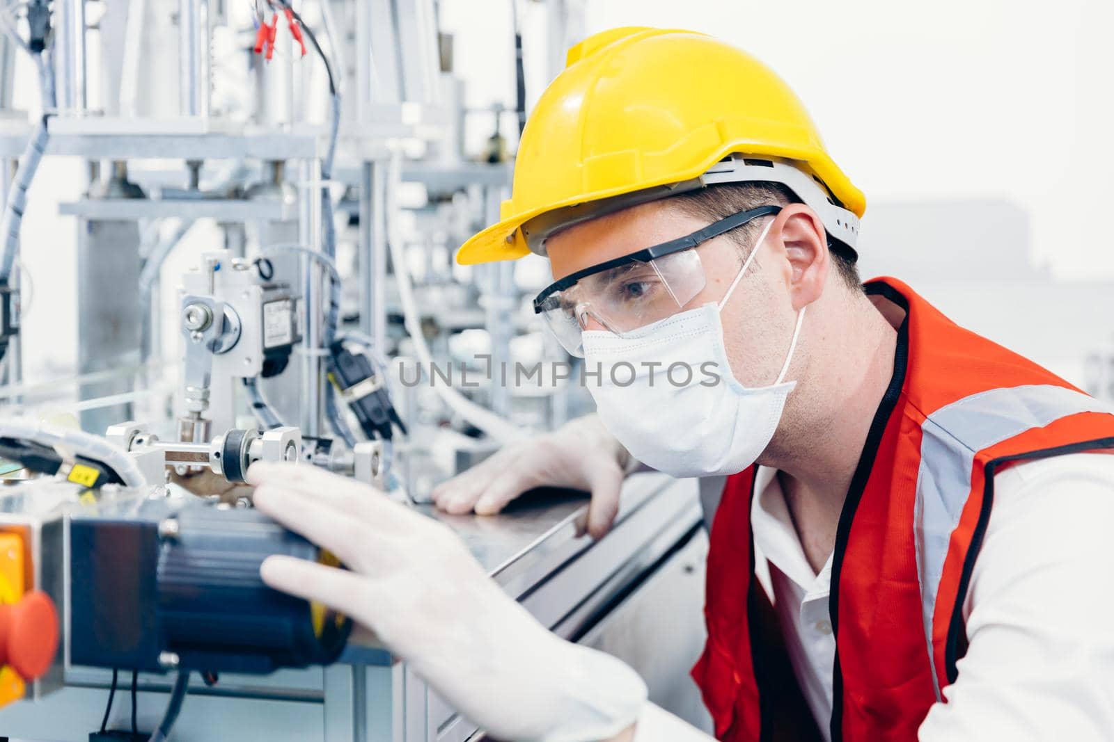Professional Engineer male service advance technology machine with clean healthcare wareing face mask and protection safety cloth in factory science lab. by qualitystocks
