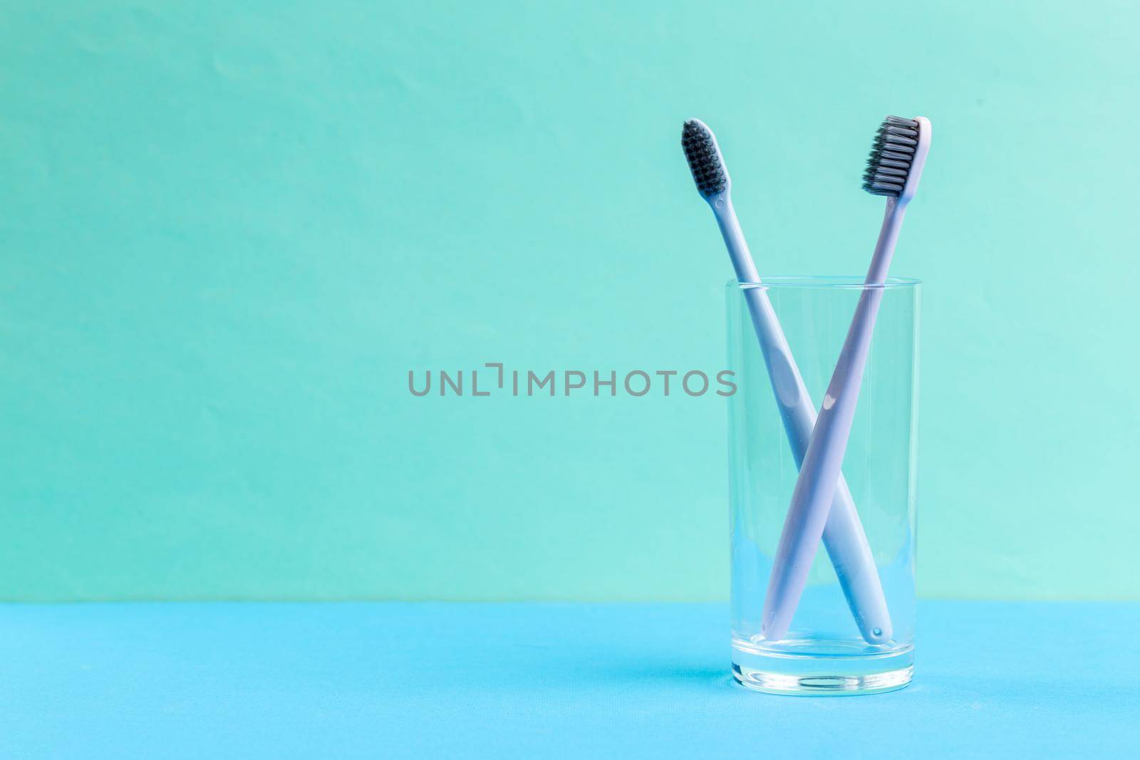 Toothbrushes in glass. creative photo.