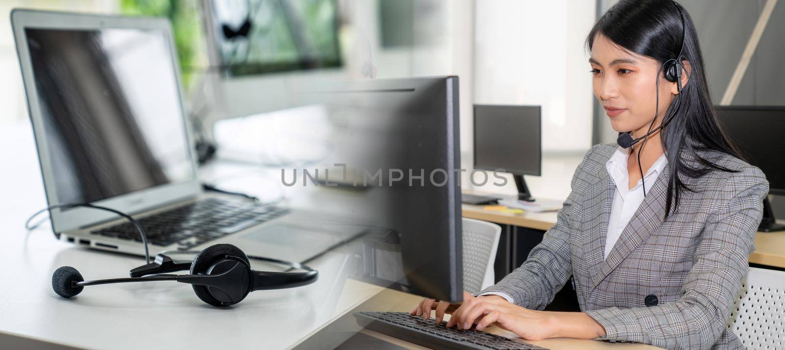 Business people wearing headset working in office broaden view by biancoblue