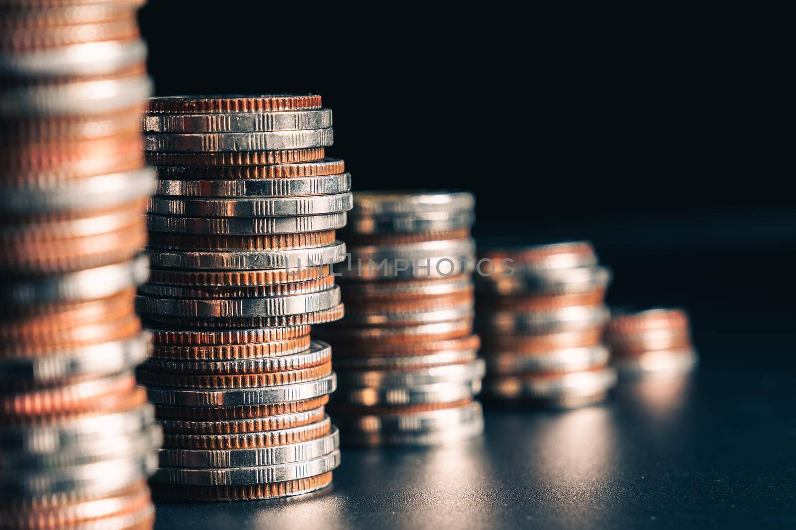Pile of gold coins stack in finance treasury deposit bank account for saving . Concept of corporate business economy and financial growth by investment in valuable asset to gain cash revenue profit .