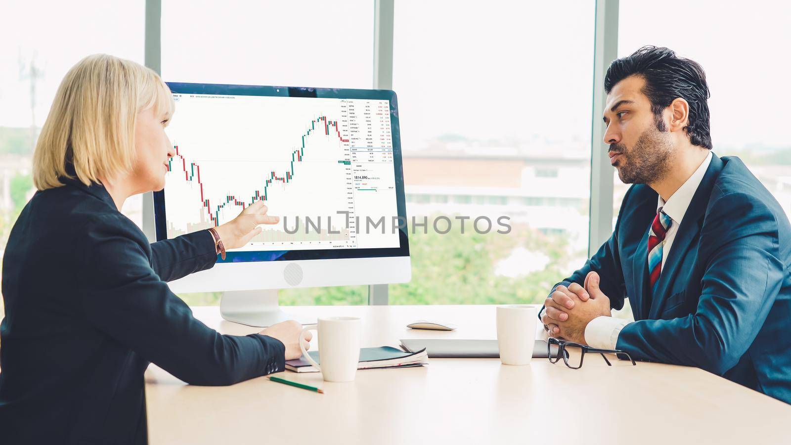 Stock market data chart analysis by ingenious computer software . Investment application display stock market chart on the computer screen and advise trading decision .