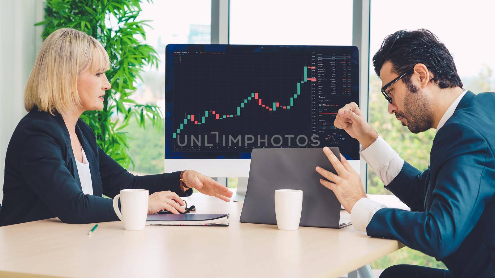 Stock market data chart analysis by ingenious computer software . Investment application display stock market chart on the computer screen and advise trading decision .