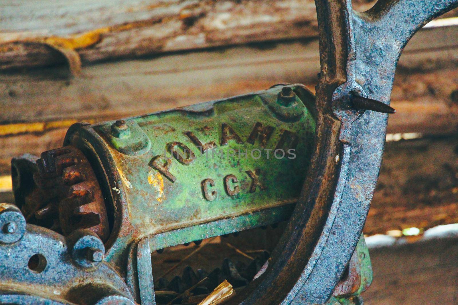 Remains of an old agricultural machinery made in Poland . High quality photo