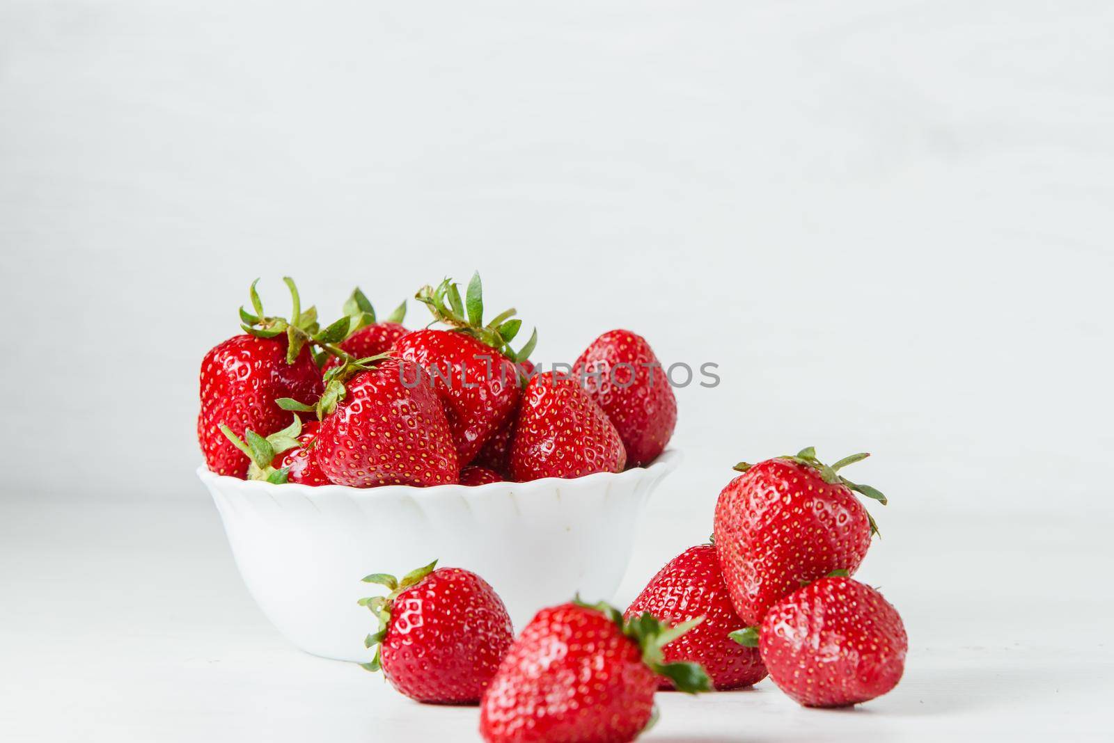 Red strawberry healthy vitamin berry isolated on white background. by Rabizo