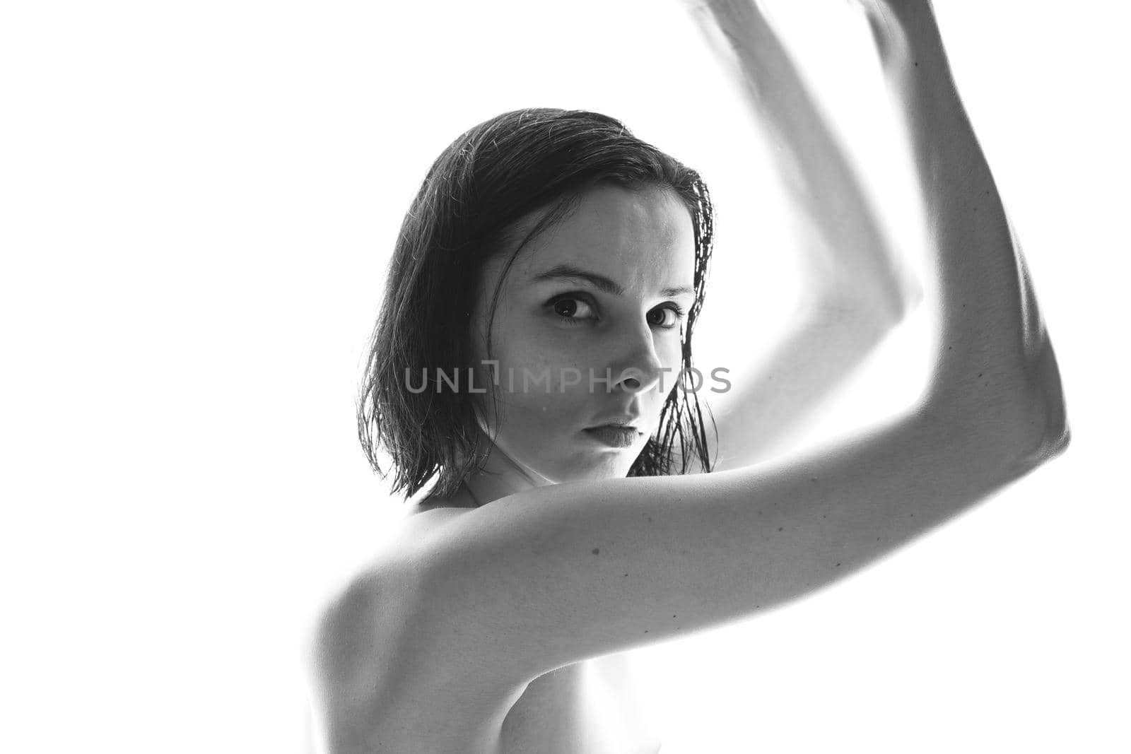 beautiful brunette woman white background, black and white photo by shilovskaya