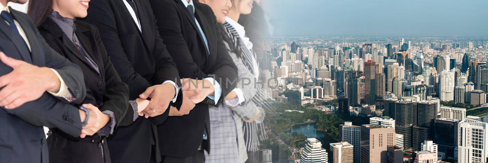 Successful business people standing together broaden view by biancoblue