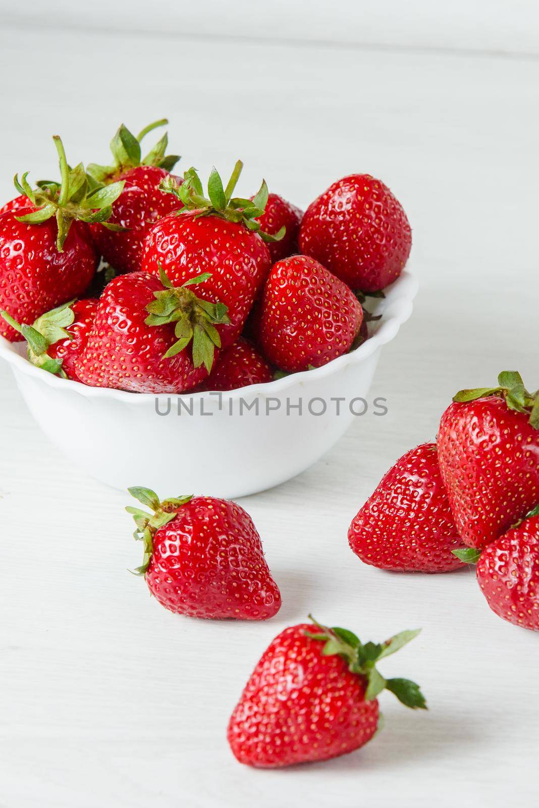 Red strawberry healthy vitamin berry isolated on white background. by Rabizo